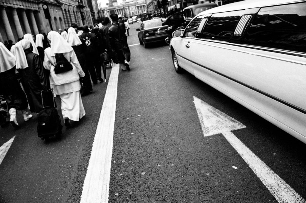 In a demonstration of solidarity between the two groups, Christian nuns and members of the Nation of Islam (NOI) march together down Whitehall during the 2004 Million Man March between Parliament Square and Trafalgar Square in London. Image copyright © Thaddeus Pope, 2004.