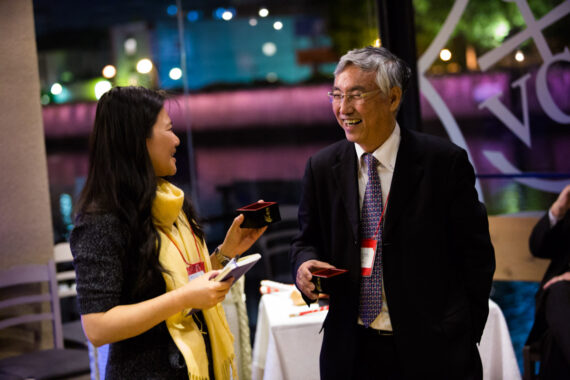 Delegates enjoy sake (Japanese rice wine) served in traditional “masu” boxes at The Asian Conference on Education (ACE) welcome reception in Osaka, Japan. Delegates enjoy sake (Japanese rice wine) served in traditional “masu” boxes at The Asian Conference on Education (ACE) welcome reception in Osaka, Japan.