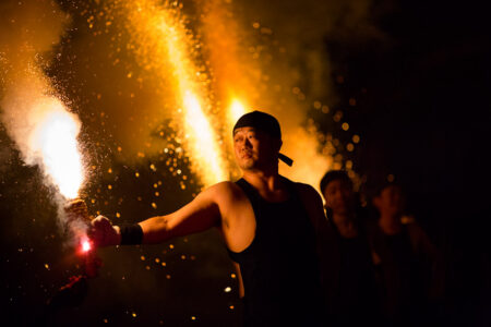 Preparing to light a tezutsu hand-held firework during Bon Odori in Nagoya, Japan.