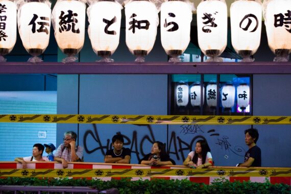Spectators watch the final parade of the evening during the Kishiwada Danjiri Matsuri in Osaka, Japan.