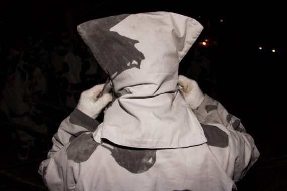 The costumes worn by Toba-dai-kagaribi festival participants are made from the thick cotton banners of previous festivals. Because of the catlike appearance of their hoods, the men are often referred to as ‘neko’ (cats) by local townspeople. From the series "The Great Bonfire of Toba".