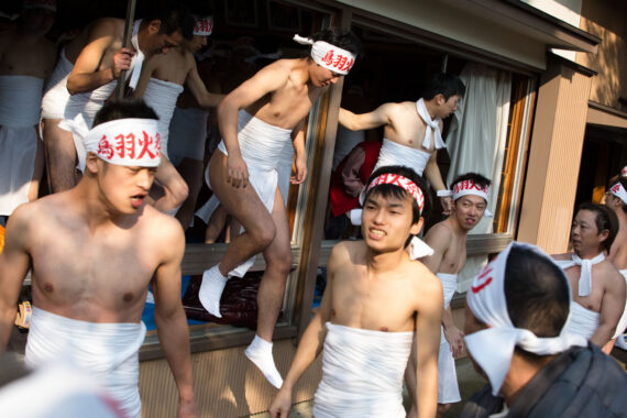 Having enjoyed some early morning sake (rice wine), the men emerge from Toba Shinmeisha Shrine wearing their traditional festival loincloths.