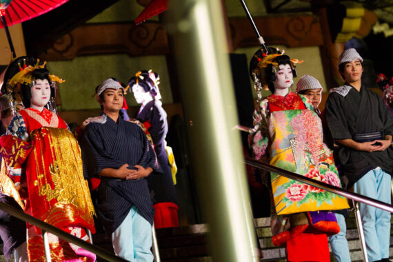 Couples wearing traditional festival clothing make their way down the steps of Osu Kannon Temple in Nagoya, Japan.