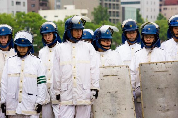 Due to the number of politicians and senior dignitaries in attendance, including Japanese Prime Minister, Shinzō Abe, and US Ambassador to Japan, Caroline Kennedy, large numbers of policemen oversee the annual Hiroshima Peace Memorial Ceremony. From the series "Hiroshima".