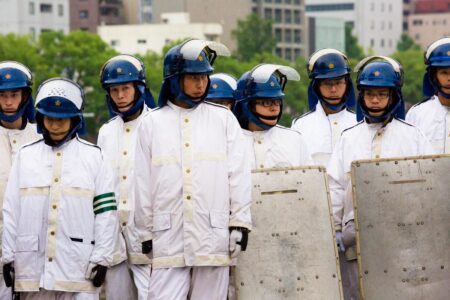 Due to the number of politicians and senior dignitaries in attendance, including Japanese Prime Minister, Shinzō Abe, and US Ambassador to Japan, Caroline Kennedy, large numbers of policemen oversee the annual Hiroshima Peace Memorial Ceremony. From the series "Hiroshima".
