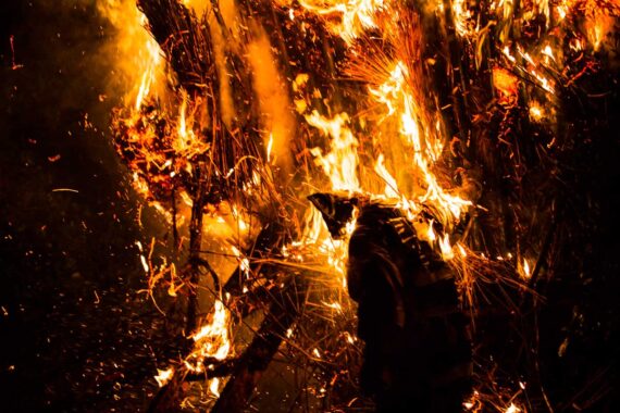 With his costume on fire, one man is forced to jump from the burning suzumi.