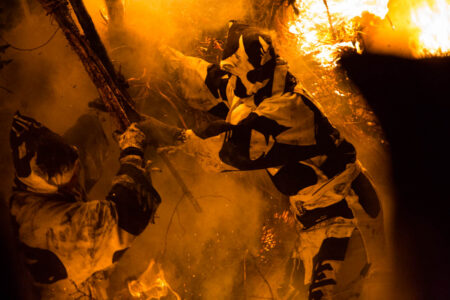 Two men are able to tear off a portion of the suzumi.