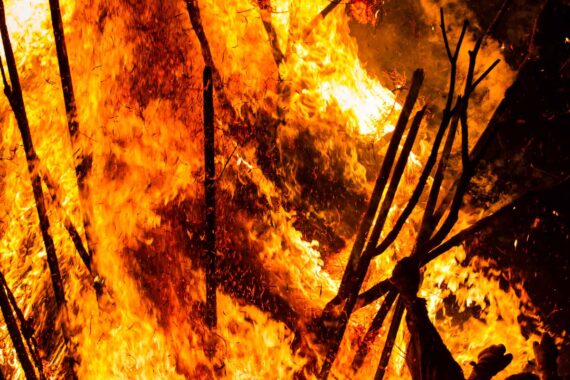 As the suzumi topples onto its side, an enormous wall of fire engulfs the men.