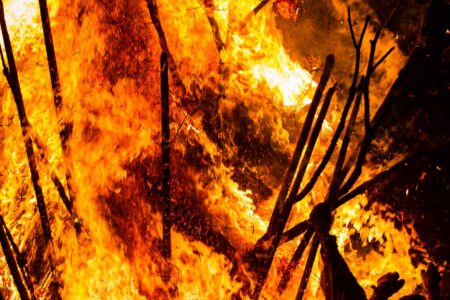 As the suzumi topples onto its side, an enormous wall of fire engulfs the men.